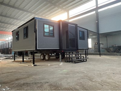 바퀴가 달린 확장형 컨테이너 하우스